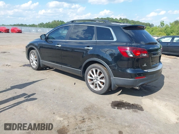 2015 Mazda CX-9 Grand Touring with VIN JM3TB2DA4F0464186, listed as a IAAI auction lot 42227595 with 124,526 mi miles and . Bid and sale history available at DreamBid. Image 3.