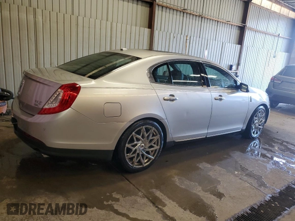 2013 Lincoln MKS z VIN 1LNHL9EK0DG605184, wystawiony jako Copart lot #51914305 z przebiegiem 173 117 mil mil oraz Szkoda całkowita • Salvage title. Historia ofert i sprzedaży dostępna na DreamBid. Obrazek 3.