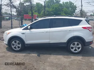 2013 Ford Escape SE z VIN 1FMCU9GXXDUD82847, wystawiony jako IAAI lot #42436360 z przebiegiem 142 071 mil mil oraz . Historia ofert i sprzedaży dostępna na DreamBid. Obrazek 13.