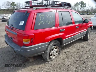 2001 Jeep Grand Cherokee Laredo with VIN 1J4GX48SX1C522670, listed as a IAAI auction lot 42111708 with Not provided miles and . Bid and sale history available at DreamBid. Image 4.