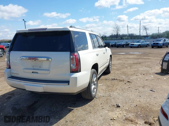 2015 GMC Yukon Denali with VIN 1GKS1CKJ5FR285199, listed as a IAAI auction lot 41763187 with 135,265 mi miles. Bid and sale history available at carsss.com. Image 4.