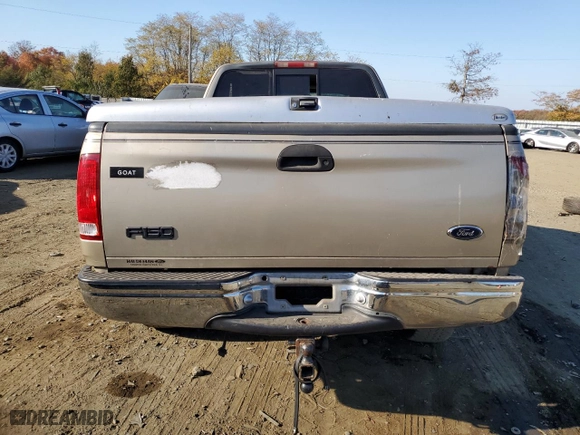 1999 Ford F-150 Work Series with VIN 1FTRX18WXXNA56977, listed as a Copart auction lot 77179044 with 0 mi miles and Salvage Title. Bid and sale history available at carsss.com. Image 6.