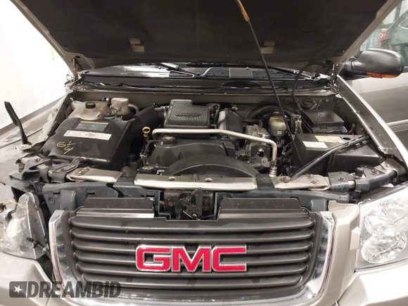 2003 GMC Envoy SLT with VIN 1GKDT13S932395367, listed as a IAAI auction lot 41544810 with 142,012 mi miles. Bid and sale history available at carsss.com. Image 10.