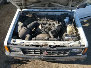 1990 Mitsubishi Mighty Max z VIN JA7FL24W3LP007688, wystawiony jako Copart lot #42651005 z przebiegiem 265 379 mil mil oraz Tytuł czysty. Historia ofert i sprzedaży dostępna na DreamBid. Obrazek 11.