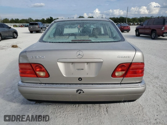 1999 Mercedes-Benz E-Class with VIN WDBJF82H9XX022535, listed as a Copart auction lot 86554534 with 140,904 mi miles and Salvage Title. Bid and sale history available at carsss.com. Image 6.