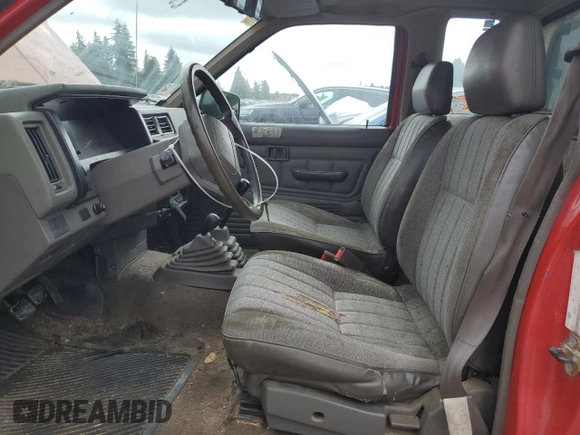 1989 Nissan Hardbody E z VIN 1N6ND16Y9KC352795, wystawiony jako Copart lot #72202814 z przebiegiem 242 396 mil mil oraz Tytuł czysty. Historia ofert i sprzedaży dostępna na DreamBid. Obrazek 7.