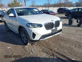 2022 BMW X4 xDrive30i with VIN 5UX33DT05N9L03865, listed as a IAAI auction lot 41216034 with 69,376 mi miles. Bid and sale history available at carsss.com. Image 1.