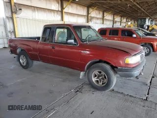 1999 Mazda B-Series 2WD Truck SE with VIN 4F4YR16V0XTM10024, listed as a Copart auction lot 82905694 with 163,025 mi miles and Salvage Title. Bid and sale history available at carsss.com. Image 4.