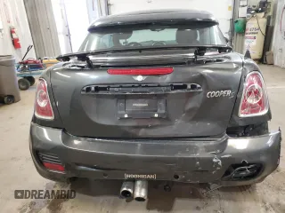 2012 MINI Coupe S z VIN WMWSX3C50CT154835, wystawiony jako Copart lot #76659984 z przebiegiem 122 425 mil mil oraz Szkody całkowita. Historia ofert i sprzedaży dostępna na DreamBid. Obrazek 6.