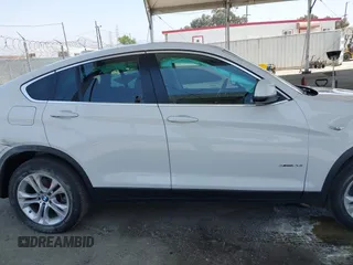2015 BMW X4 xDrive28i with VIN 5UXXW3C5XF0M89259, listed as a IAAI auction lot 42553903 with 98,960 mi miles and . Bid and sale history available at DreamBid. Image 13.