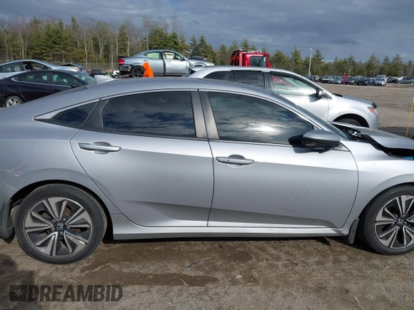 2018 Honda Civic EX-T z VIN 2HGFC1F34JH641837, wystawiony jako IAAI lot #41858089 z przebiegiem 65 318 mil mil oraz . Historia ofert i sprzedaży dostępna na DreamBid. Obrazek 13.