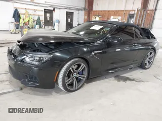 2014 BMW M6 z VIN WBSLZ9C58EDZ78401, wystawiony jako IAAI lot #41840114 z przebiegiem 23 499 mil mil oraz . Historia ofert i sprzedaży dostępna na DreamBid. Obrazek 2.