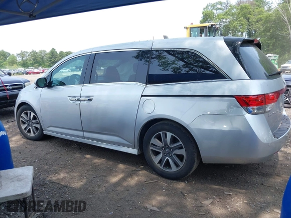 2014 Honda Odyssey Touring with VIN 5FNRL5H97EB054158, listed as a IAAI auction lot 42548360 with 91,161 mi miles and . Bid and sale history available at DreamBid. Image 14.