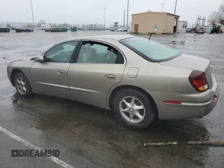 2001 Oldsmobile Aurora z VIN 1G3GR64H214292879, wystawiony jako Copart lot #79613954 z przebiegiem 88 709 mil mil oraz Szkody całkowita. Historia ofert i sprzedaży dostępna na DreamBid. Obrazek 2.