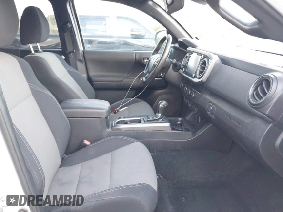 2020 Toyota Tacoma SR5 with VIN 3TMBZ5DN7LM026596, listed as a IAAI auction lot 40705410 with 123,489 mi miles and . Bid and sale history available at DreamBid. Image 5.