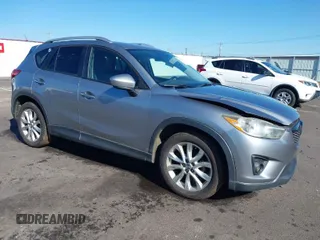 2014 Mazda CX-5 Grand Touring with VIN JM3KE2DY9E0323497, listed as a IAAI auction lot 41678360 with 216,795 mi miles. Bid and sale history available at carsss.com. Image 1.
