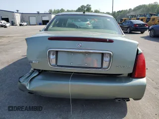2005 Cadillac DeVille z VIN 1G6KD54Y25U234041, wystawiony jako Copart lot #57306265 z przebiegiem 200 302 mil mil oraz Szkoda całkowita • Salvage title. Historia ofert i sprzedaży dostępna na DreamBid. Obrazek 6.
