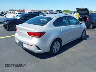2023 Kia Rio S z VIN 3KPA24AD4PE592446, wystawiony jako IAAI lot #42244022 z przebiegiem 13 759 mil mil oraz . Historia ofert i sprzedaży dostępna na DreamBid. Obrazek 4.
