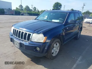 2005 Jeep Grand Cherokee Laredo with VIN 1J4HR48N45C605543, listed as a IAAI auction lot 42612473 with 158,456 mi miles and . Bid and sale history available at DreamBid. Image 2.