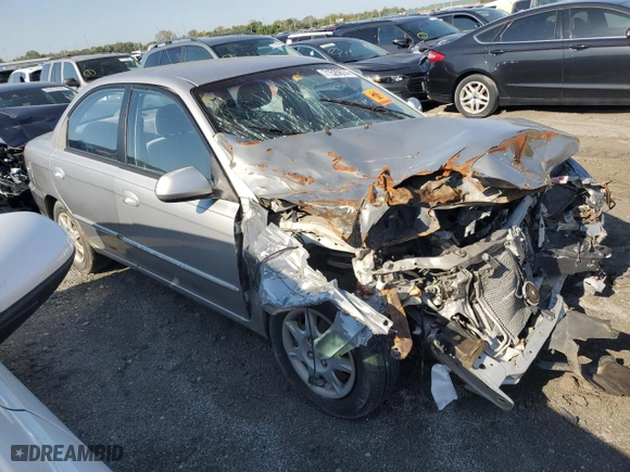 2003 Kia Spectra with VIN KNAFB121835244872, listed as a Copart auction lot 71520674 with 0 mi miles and Salvage Title. Bid and sale history available at carsss.com. Image 4.