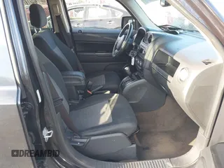 2014 Jeep Patriot Latitude with VIN 1C4NJRFB4ED720241, listed as a IAAI auction lot 40914199 with 128,218 mi miles. Bid and sale history available at carsss.com. Image 5.