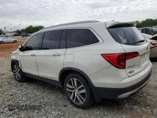 2017 Honda Pilot Touring z VIN 5FNYF6H92HB067140, wystawiony jako Copart lot #55757925 z przebiegiem 132 425 mil mil oraz Szkoda całkowita • Salvage title. Historia ofert i sprzedaży dostępna na DreamBid. Obrazek 2.