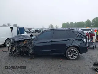 2015 BMW X5 xDrive50i z VIN 5UXKR6C56F0J78575, wystawiony jako IAAI lot #41933018 z przebiegiem Nie podano mil oraz . Historia ofert i sprzedaży dostępna na DreamBid. Obrazek 15.
