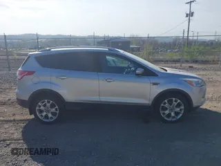 2016 Ford Escape Titanium with VIN 1FMCU9JX2GUA50916, listed as a IAAI auction lot 42118711 with 121,405 mi miles. Bid and sale history available at carsss.com. Image 14.