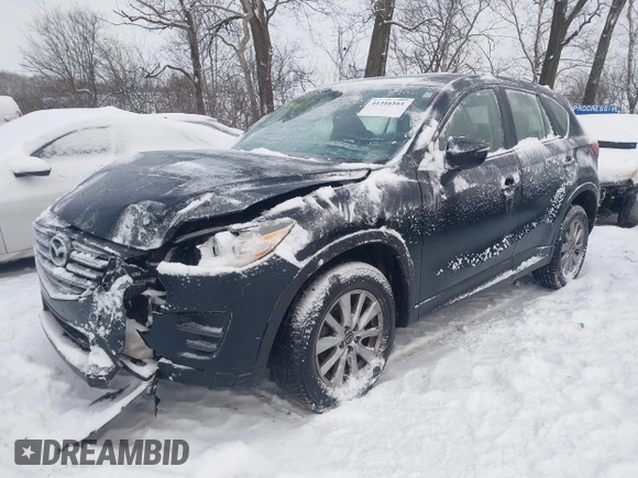 2016 Mazda CX-5 Sport z VIN JM3KE4BY0G0919017, wystawiony jako IAAI lot #41316161 z przebiegiem 209 259 mil mil oraz . Historia ofert i sprzedaży dostępna na DreamBid. Obrazek 6.