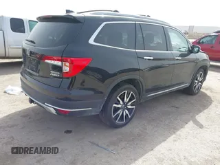 2020 Honda Pilot Touring 8-Passenger with VIN 5FNYF6H91LB003552, listed as a IAAI auction lot 41743685 with 76,725 mi miles and . Bid and sale history available at DreamBid. Image 4.