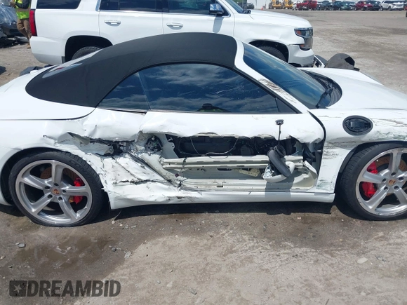 2014 Porsche 911 Carrera S z VIN WP0CB2A97ES154099, wystawiony jako IAAI lot #42264557 z przebiegiem 89 991 mil mil oraz . Historia ofert i sprzedaży dostępna na DreamBid. Obrazek 6.
