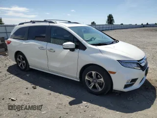 2018 Honda Odyssey Touring with VIN 5FNRL6H8XJB018438, listed as a Copart auction lot 61876505 with 104,581 mi miles and Salvage title. Bid and sale history available at DreamBid. Image 4.