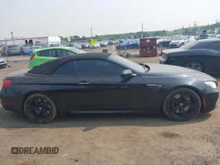 2014 BMW M6 z VIN WBSLZ9C5XEDZ78402, wystawiony jako IAAI lot #42399055 z przebiegiem 127 803 mil mil oraz . Historia ofert i sprzedaży dostępna na DreamBid. Obrazek 13.