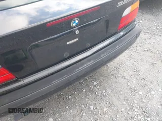 1999 BMW 3 Series 323i with VIN WBABJ8330XEM23911, listed as a IAAI auction lot 42523948 with 125,371 mi miles and . Bid and sale history available at DreamBid. Image 6.