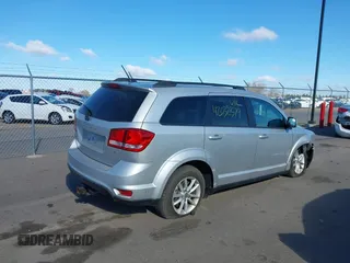 2013 Dodge Journey SXT with VIN 3C4PDDBG4DT506900, listed as a IAAI auction lot 42032379 with 130,911 mi miles and . Bid and sale history available at DreamBid. Image 4.