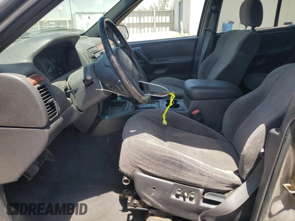 1999 Jeep Grand Cherokee Laredo with VIN 1J4GW58S1XC775877, listed as a Copart auction lot 55639795 with 197,611 mi miles and Salvage title. Bid and sale history available at DreamBid. Image 7.