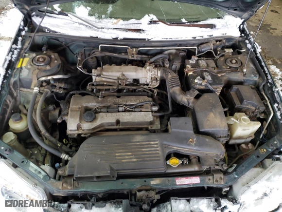 1999 Mazda Protege DX with VIN JM1BJ2220X0108600, listed as a Copart auction lot 77004894 with 220,836 mi miles and Salvage Title. Bid and sale history available at carsss.com. Image 11.