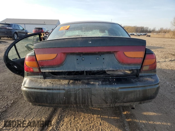2000 Saturn SL with VIN 1G8ZK527XYZ259766, listed as a Copart auction lot 48911825 with Not provided miles and Salvage title. Bid and sale history available at DreamBid. Image 6.