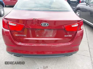 2014 Kia Optima EX z VIN 5XXGN4A71EG284280, wystawiony jako IAAI lot #42278795 z przebiegiem 179 200 mil mil oraz . Historia ofert i sprzedaży dostępna na DreamBid. Obrazek 6.