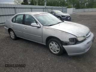 1999 Nissan Altima XE z VIN 1N4DL01D1XC202466, wystawiony jako Copart lot #54548015 z przebiegiem 131 409 mil mil oraz Szkoda całkowita • Salvage title. Historia ofert i sprzedaży dostępna na DreamBid. Obrazek 4.