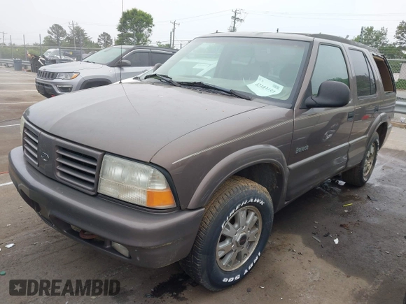 1998 Oldsmobile Bravada z VIN 1GHDT13W6W2727777, wystawiony jako IAAI lot #42103153 z przebiegiem 187 176 mil mil oraz . Historia ofert i sprzedaży dostępna na DreamBid. Obrazek 2.