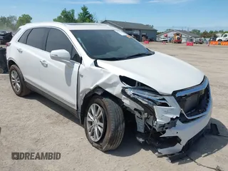2022 Cadillac XT5 AWD Premium Luxury z VIN 1GYKNDRS7NZ155485, wystawiony jako IAAI lot #42300769 z przebiegiem 26 695 mil mil oraz . Historia ofert i sprzedaży dostępna na DreamBid. Obrazek 1.
