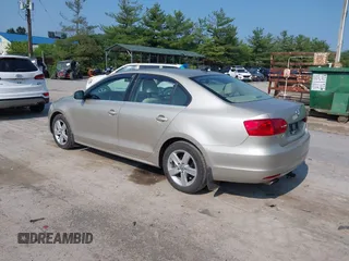 2014 Volkswagen Jetta TDI w/Premium with VIN 3VW3L7AJ3EM319365, listed as a IAAI auction lot 42479875 with 133,068 mi miles and . Bid and sale history available at DreamBid. Image 3.