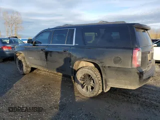 2015 GMC Yukon XL SLT with VIN 1GKS2HKC4FR697416, listed as a Copart auction lot 87887925 with 236,772 mi miles and Salvage Title. Bid and sale history available at carsss.com. Image 2.