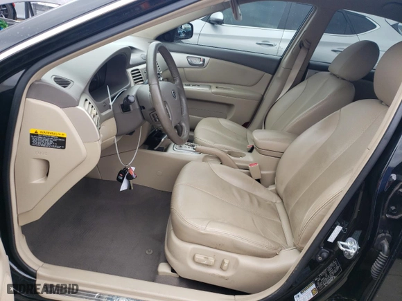2008 Kia Optima LX with VIN KNAGE123185239484, listed as a Copart auction lot 77323373 with 74,199 mi miles and Clean Title. Bid and sale history available at carsss.com. Image 7.