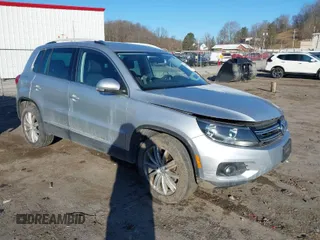 2012 Volkswagen Tiguan SE with VIN WVGAV7AX6CW519058, listed as a IAAI auction lot 41697685 with 35,031 mi miles and . Bid and sale history available at DreamBid. Image 1.