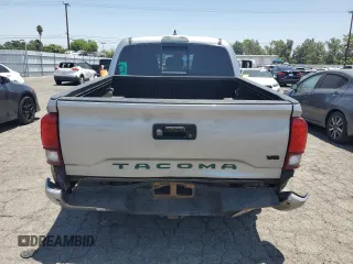 2019 Toyota Tacoma SR with VIN 3TMCZ5AN2KM277551, listed as a Copart auction lot 61586585 with 59,670 mi miles and Salvage title. Bid and sale history available at DreamBid. Image 6.