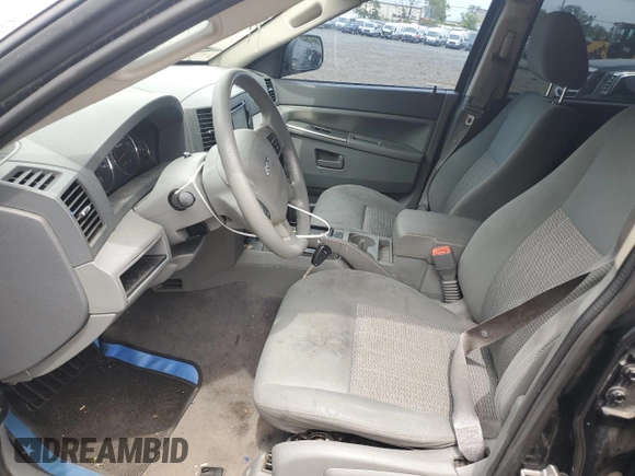 2007 Jeep Grand Cherokee Laredo z VIN 1J8GR48K47C681735, wystawiony jako Copart lot #59006435 z przebiegiem 195 517 mil mil oraz Nie do naprawy • Non repairable. Historia ofert i sprzedaży dostępna na DreamBid. Obrazek 7.