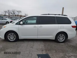 2015 Toyota Sienna XLE with VIN 5TDYK3DC9FS595827, listed as a IAAI auction lot 41014820 with 119,143 mi miles. Bid and sale history available at carsss.com. Image 14.
