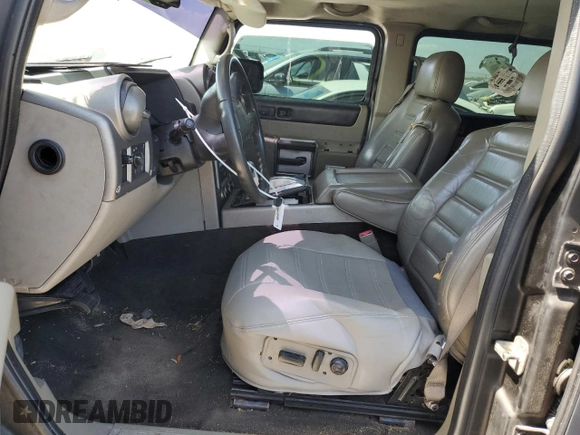 2003 Hummer H2 with VIN 5GRGN23U13H143781, listed as a Copart auction lot 77833264 with 0 mi miles and Salvage Title. Bid and sale history available at carsss.com. Image 7.